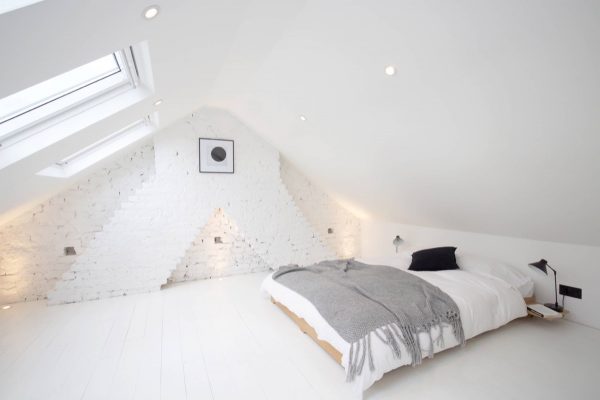 裸露的砖墙装饰的卧室设计